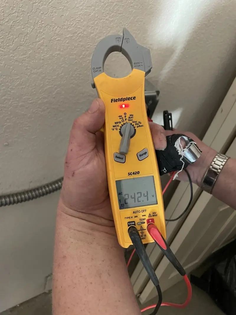Voltage testing with clamp meter during Whole House Surge Protector in Piedmont